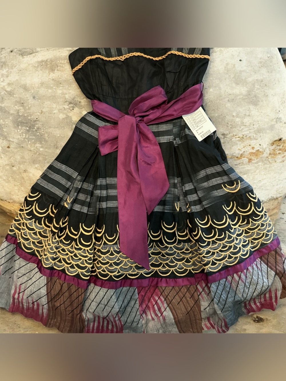 Floreat for Anthro Black Strapless Dress with Gold Trim and purple silk sash